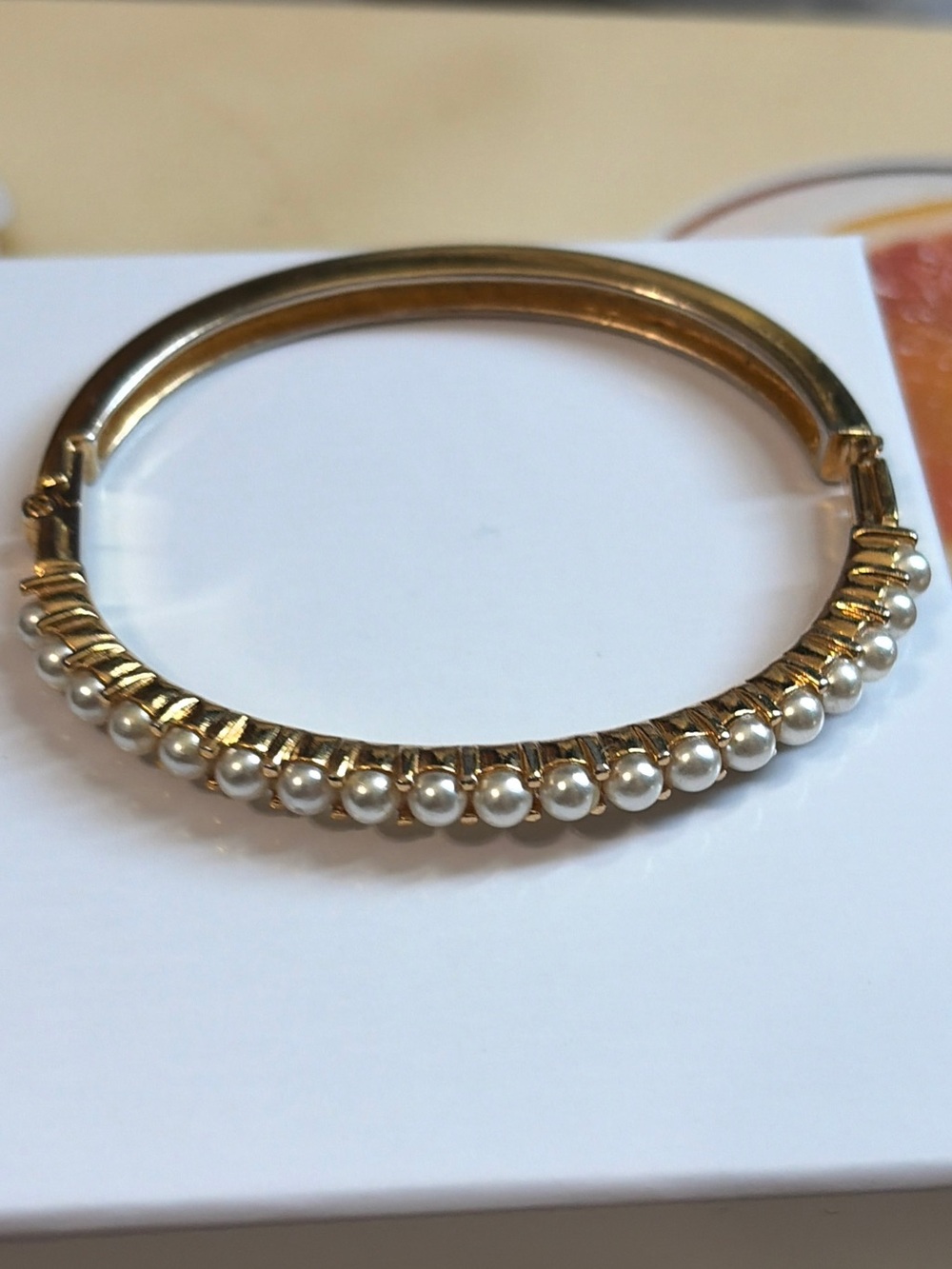 Elegant Vintage Signed Napier Faux Pearl Gold Tone Hinged Bangle Bracelet.